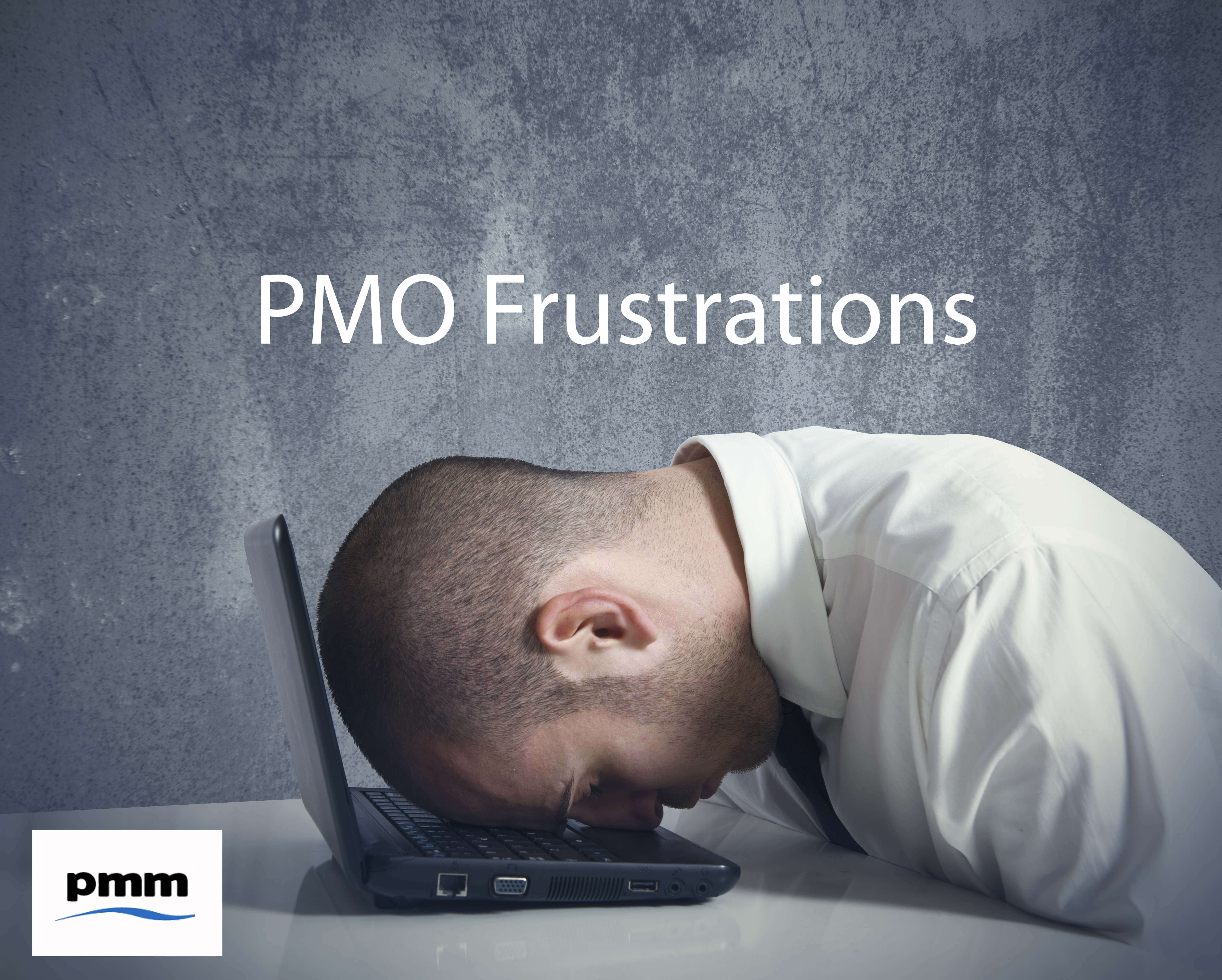 A fristrated PMO manager slumped on laptop
