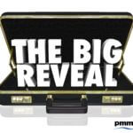 Open suit case with text "the big reveal"